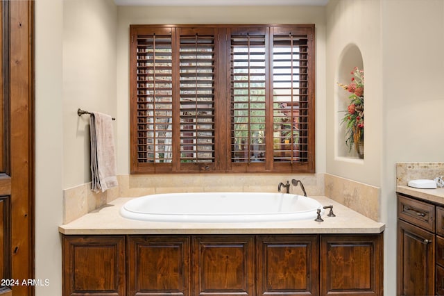 bathroom with a bathtub and vanity