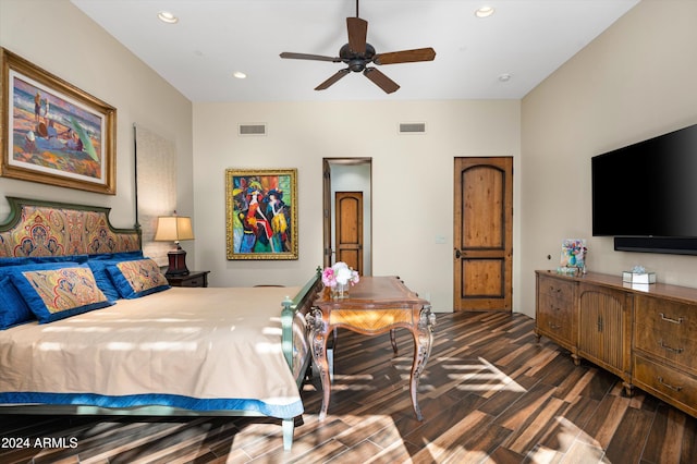 bedroom with ceiling fan and dark hardwood / wood-style floors