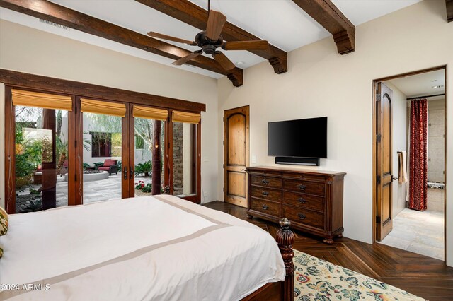 bedroom with beamed ceiling, dark parquet floors, ceiling fan, and access to exterior