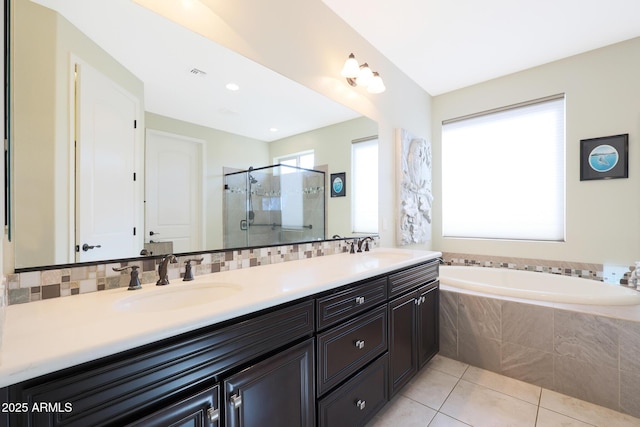 bathroom with vanity, decorative backsplash, tile patterned floors, and independent shower and bath