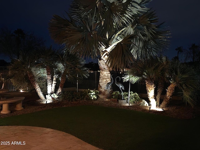 view of yard at twilight