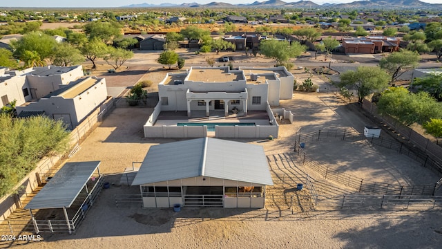 birds eye view of property featuring a mountain view