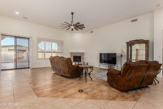 living room with light hardwood / wood-style flooring and ceiling fan