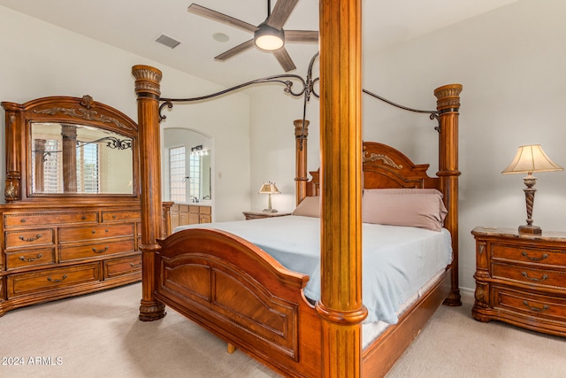 carpeted bedroom with ceiling fan and lofted ceiling