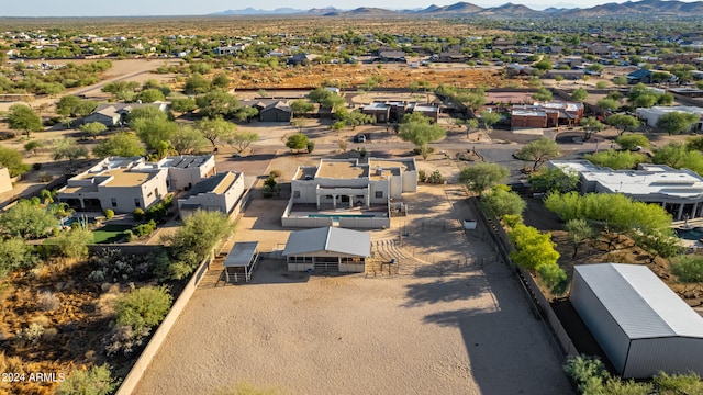 birds eye view of property featuring a mountain view