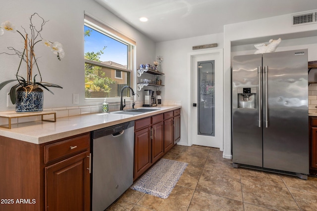 21813 N 40th Way, Phoenix, AZ 85050 - kitchen featuring appliances with stainless steel finishes, light countertops, open shelves, and tile patterned flooring