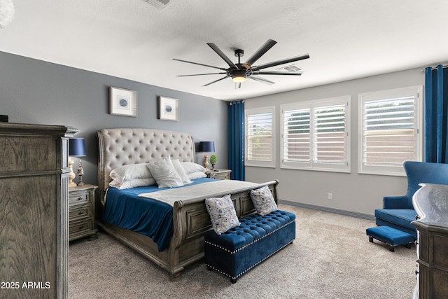 bedroom with ceiling fan, a textured ceiling, carpet flooring, and baseboards