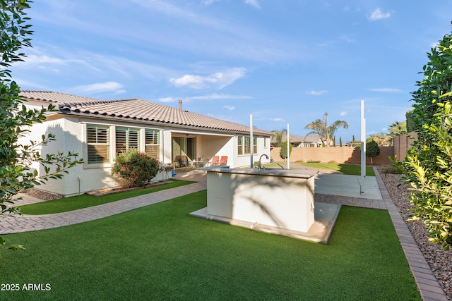 exterior space with a fenced backyard and a patio