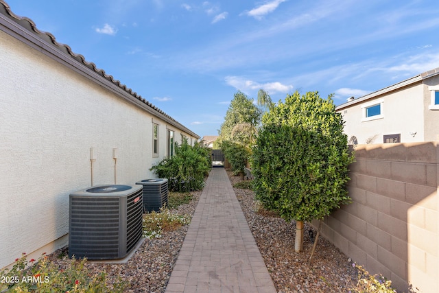 view of yard featuring a fenced backyard and central AC