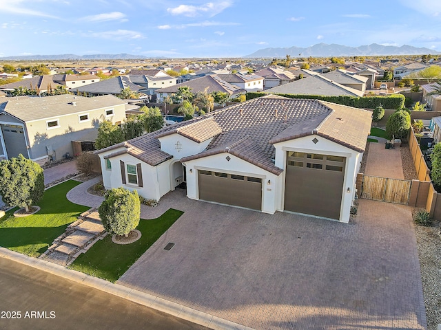 birds eye view of property with a residential view and a mountain view