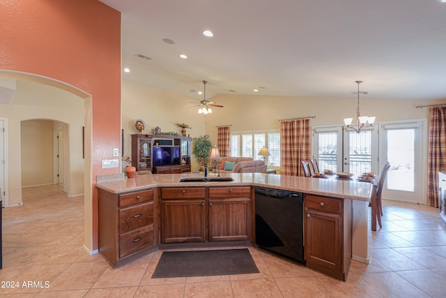 kitchen with kitchen peninsula, a healthy amount of sunlight, lofted ceiling, and black dishwasher