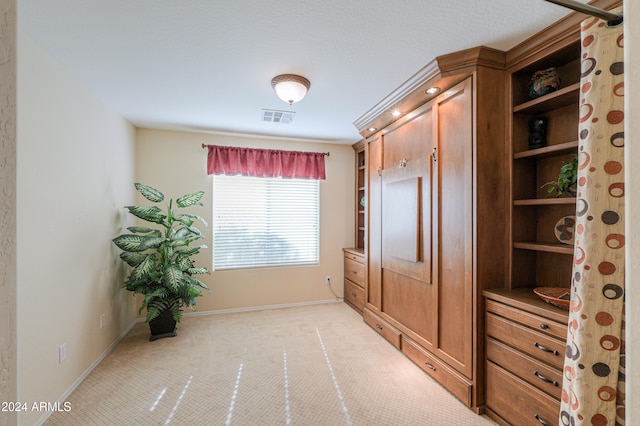 interior space featuring light carpet