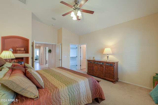 bedroom featuring ceiling fan, high vaulted ceiling, and light colored carpet