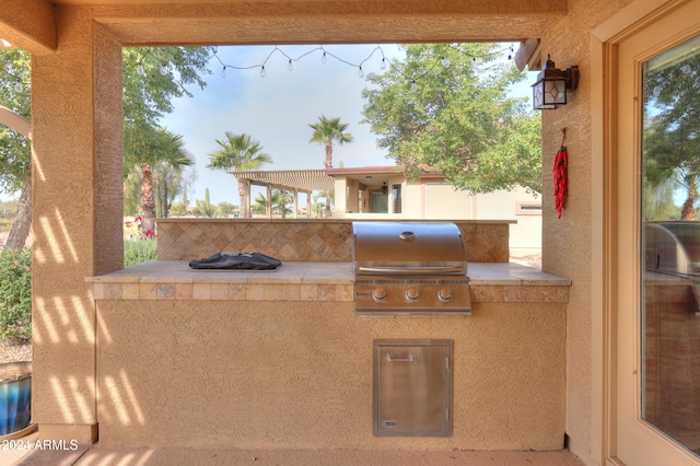 view of patio / terrace featuring an outdoor kitchen and grilling area