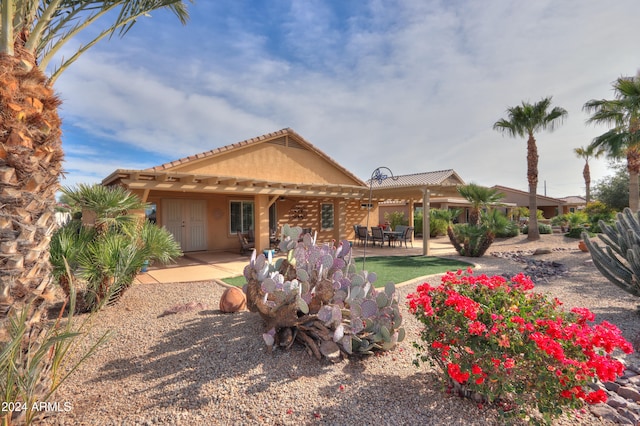 back of property with a patio area