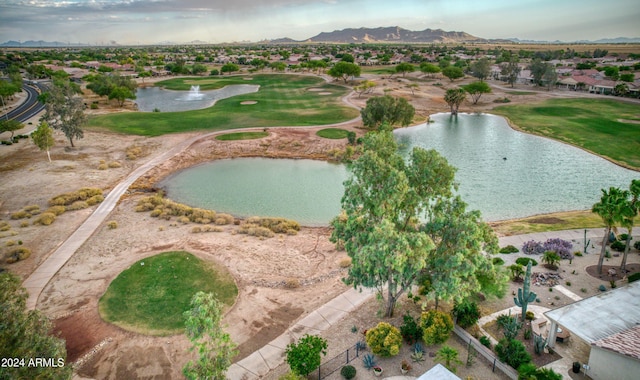 birds eye view of property featuring a water and mountain view