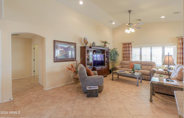 tiled living room with high vaulted ceiling and ceiling fan