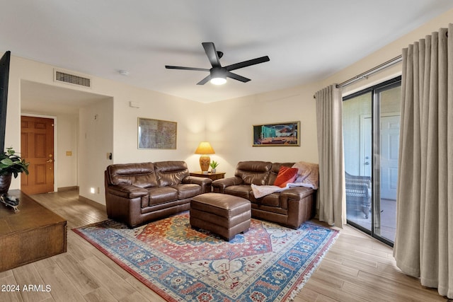 living room with ceiling fan, light hardwood / wood-style flooring, and plenty of natural light