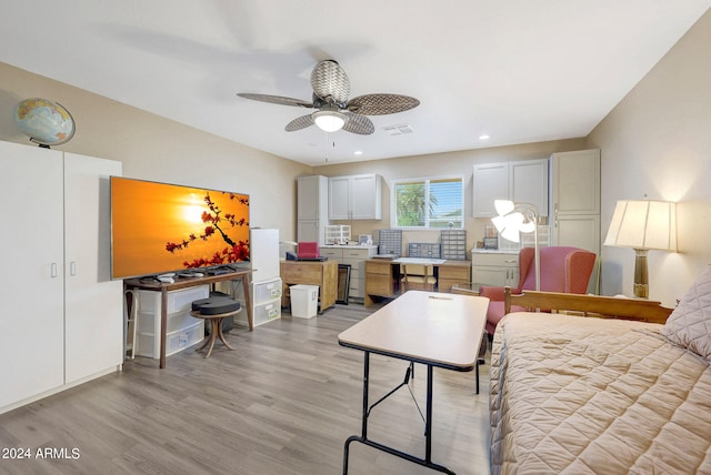 bedroom featuring light hardwood / wood-style floors and ceiling fan