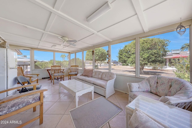 sunroom featuring ceiling fan