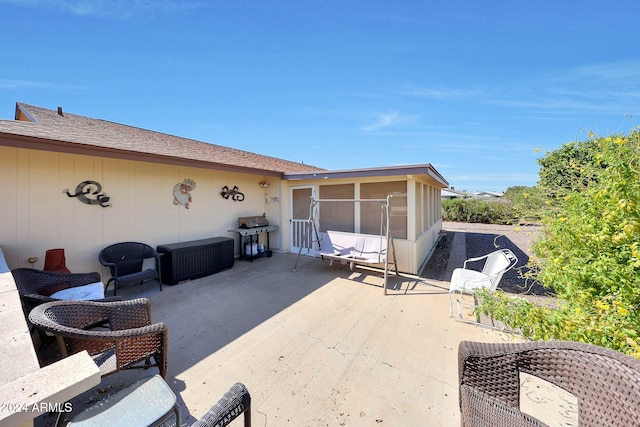 view of patio with a sunroom and grilling area