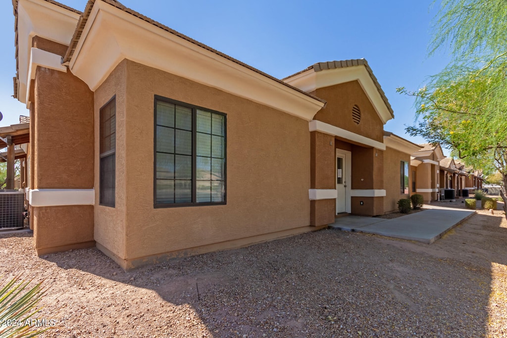 view of property exterior with central AC unit