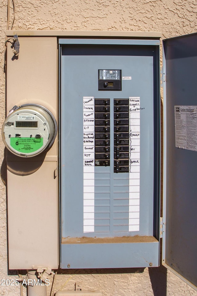 utility room featuring electric panel