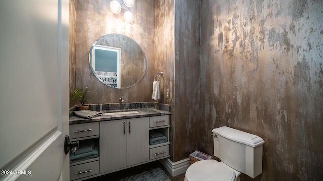 bathroom with toilet and vanity