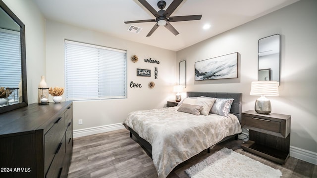 bedroom with visible vents, wood finished floors, baseboards, ceiling fan, and recessed lighting