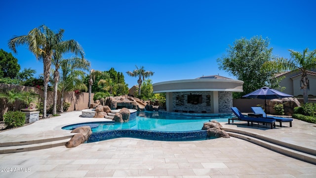 view of pool featuring a patio, a fenced in pool, and a fenced backyard