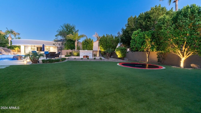 view of yard with a patio, a fenced in pool, and a fenced backyard