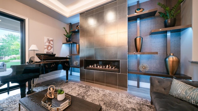 welcome area featuring a tile fireplace