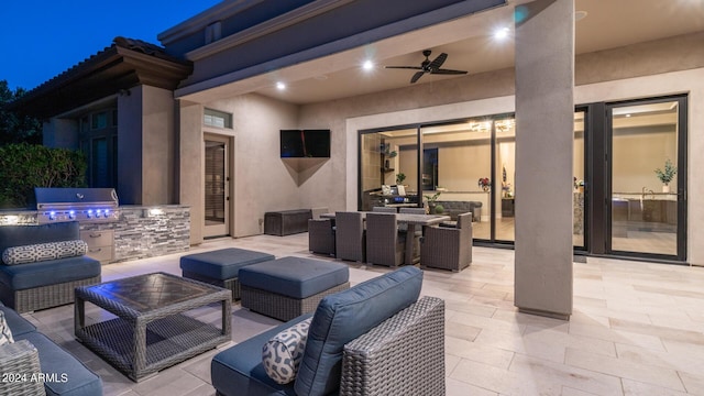 view of patio / terrace featuring outdoor lounge area, a grill, an outdoor kitchen, a ceiling fan, and outdoor dining space