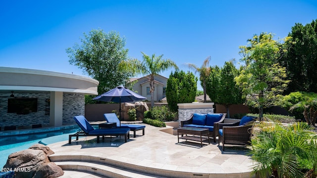 view of patio featuring a fenced in pool, fence, and outdoor lounge area