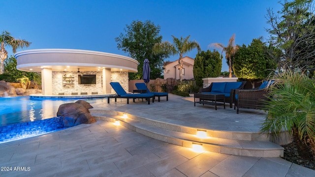 outdoor pool with outdoor lounge area and a patio area