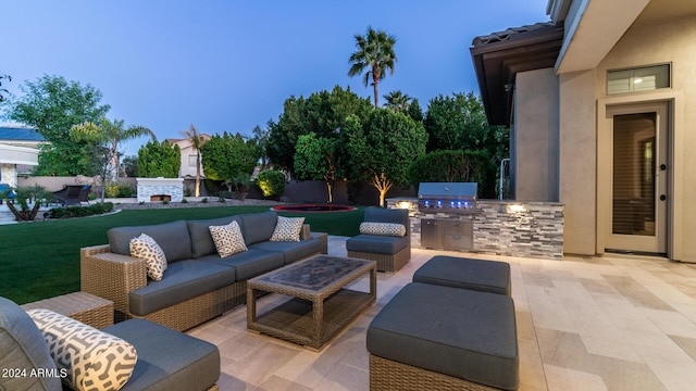 view of patio / terrace featuring area for grilling, an outdoor kitchen, and an outdoor hangout area