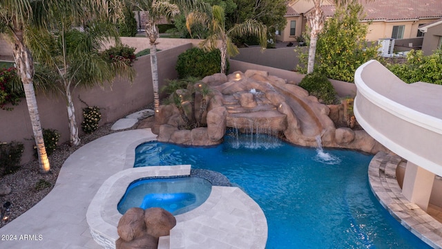 view of pool featuring a pool with connected hot tub