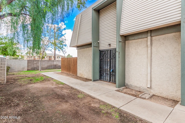 5921 W Golden Ln, Glendale, AZ 85302 - doorway to property with fence and stucco siding