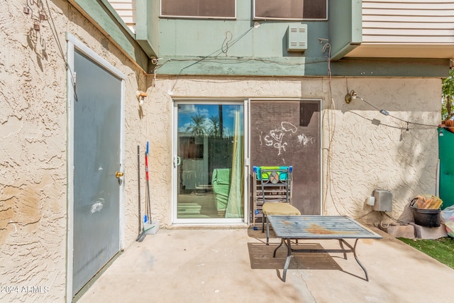 doorway to property featuring a patio