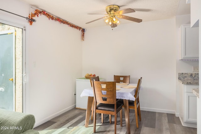5921 W Golden Ln, Glendale, AZ 85302 - dining room with light wood-style flooring, baseboards, and ceiling fan
