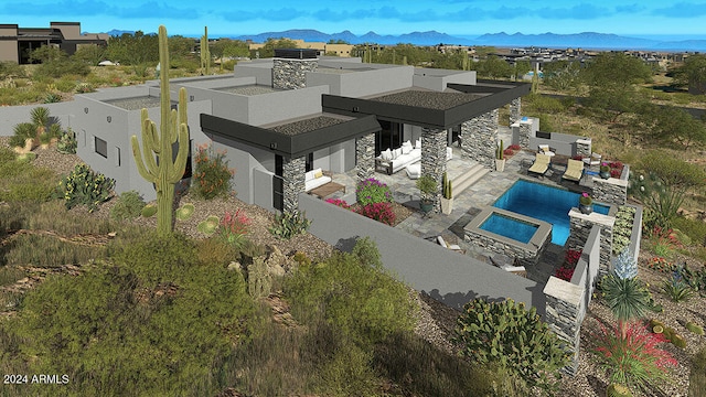 birds eye view of property with a mountain view