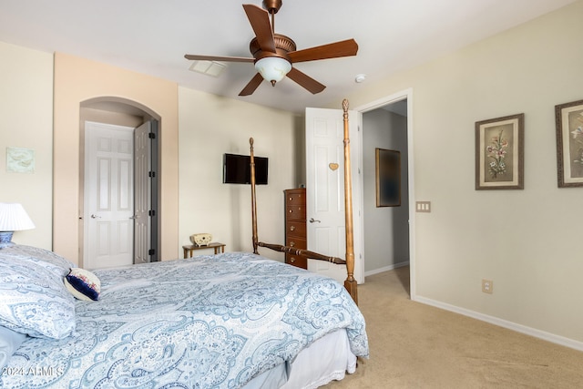 bedroom featuring ceiling fan and light colored carpet