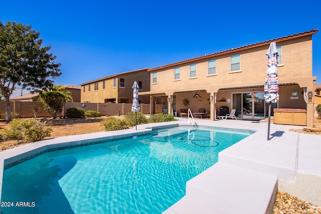 view of pool featuring a patio area and ceiling fan