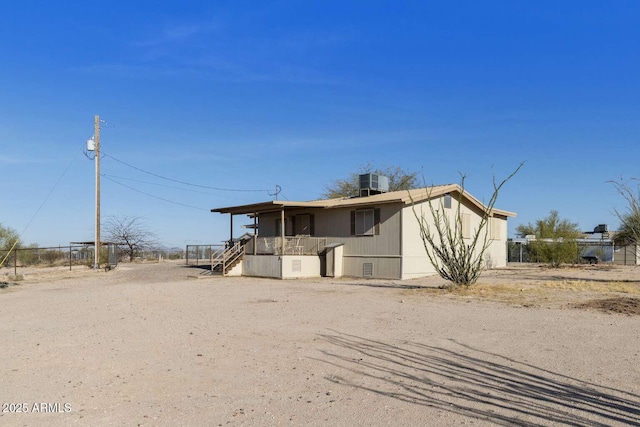 13245 N Betty Angel Way, Florence, AZ 85132 - view of front of house featuring stairs, central AC unit, and fence