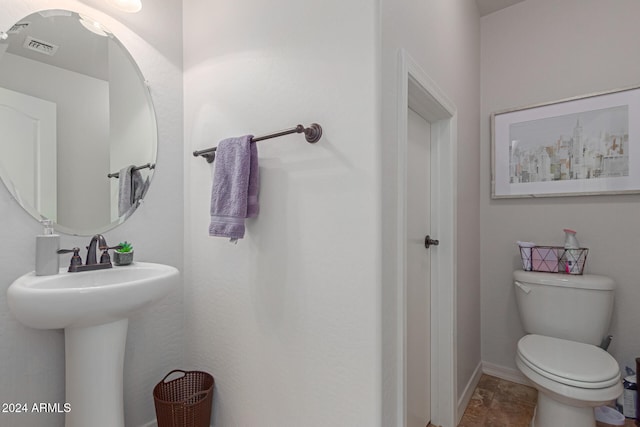 bathroom with sink and toilet