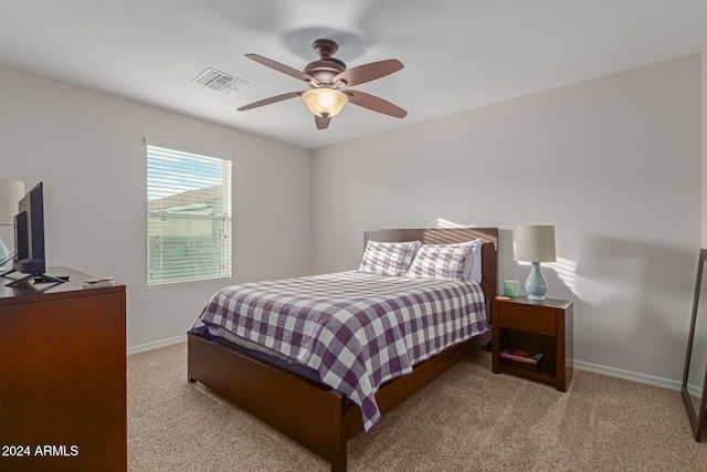 bedroom featuring light carpet and ceiling fan