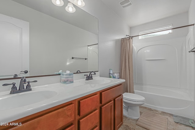 full bathroom featuring shower / tub combo with curtain, vanity, and toilet