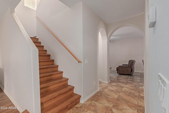 955 S Henry Ln, Gilbert, AZ 85296 - stairs with arched walkways, baseboards, and a wall unit AC