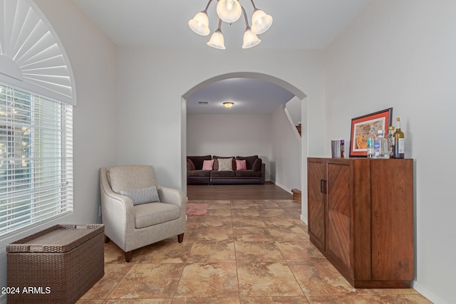 living area with a notable chandelier