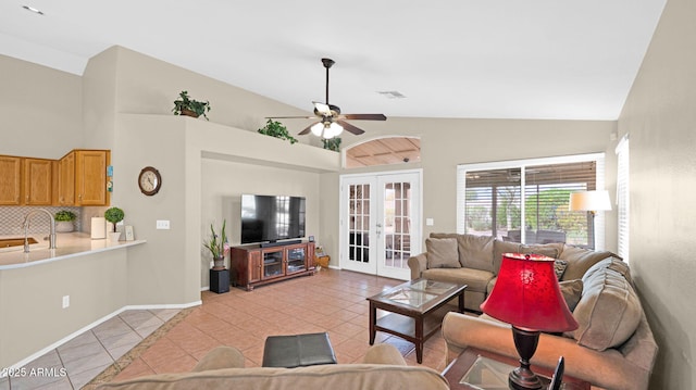 living room with light tile patterned flooring, french doors, visible vents, and ceiling fan